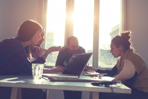 Young group of people discussing business plans.