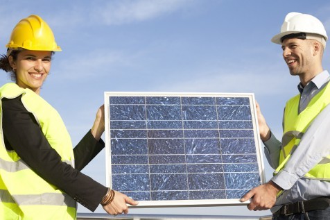 Engineers with solar panel